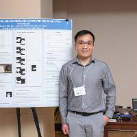Electrical and Computer Engineering graduate student, James Nguyen, standing in front of his poster.